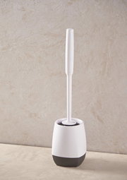 Toilettenbürste in einem weißen und schwarzen Halter, seitliche Perspektive