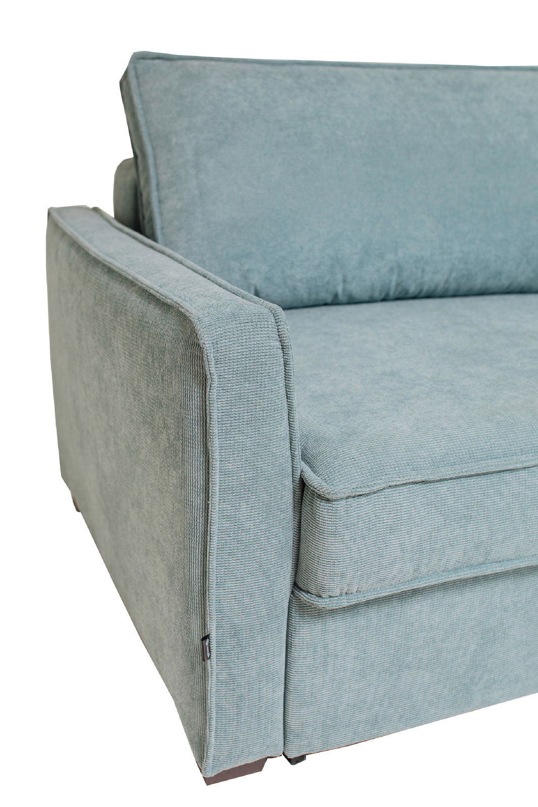 Nahaufnahme eines blauen Funktionssofas von der Seite mit Armlehne und Rückenlehne.