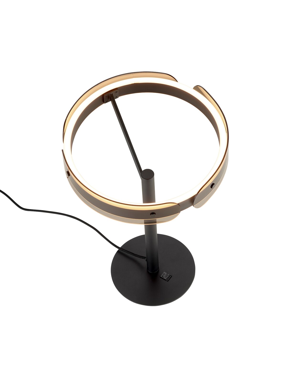 Moderne schwarze LED-Tischleuchte mit ringförmigem Licht, runder Basis und Netzkabel, schräg von oben in leichter Seitenansicht fotografiert