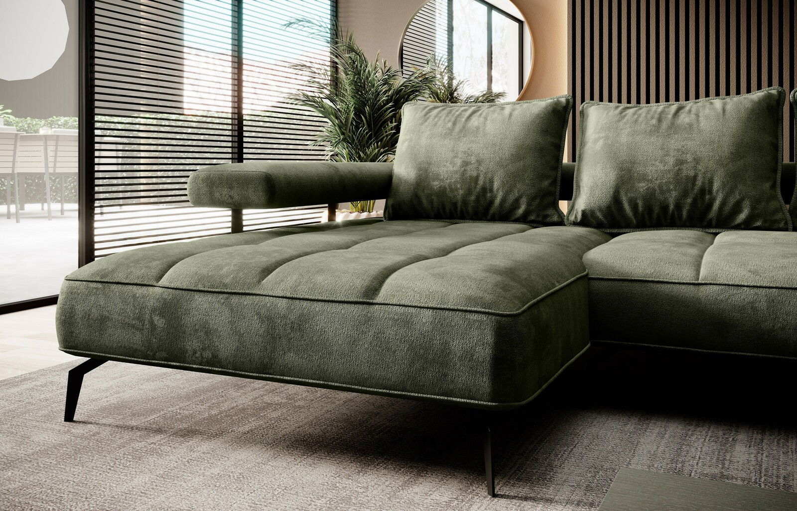 Grüne Longchairkombination in modernem Wohnzimmer, seitliche Perspektive mit Blick auf die Armlehne und Kissen.