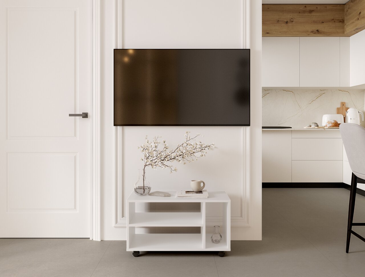 BOXXX TV-Rollwagen MAJA Weißer TV-Rollwagen mit zwei Regalböden, dekoriert mit einer Vase und einer Tasse, in einem modernen Wohnzimmer mit Blick auf die Vorderseite.