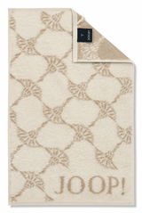 Beiges Gästetuch mit geometrischem Muster und dem Schriftzug 'JOOP!' in der unteren rechten Ecke, von oben betrachtet.
