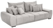 Großes, graues Big-Sofa mit mehreren Kissen, seitliche Perspektive