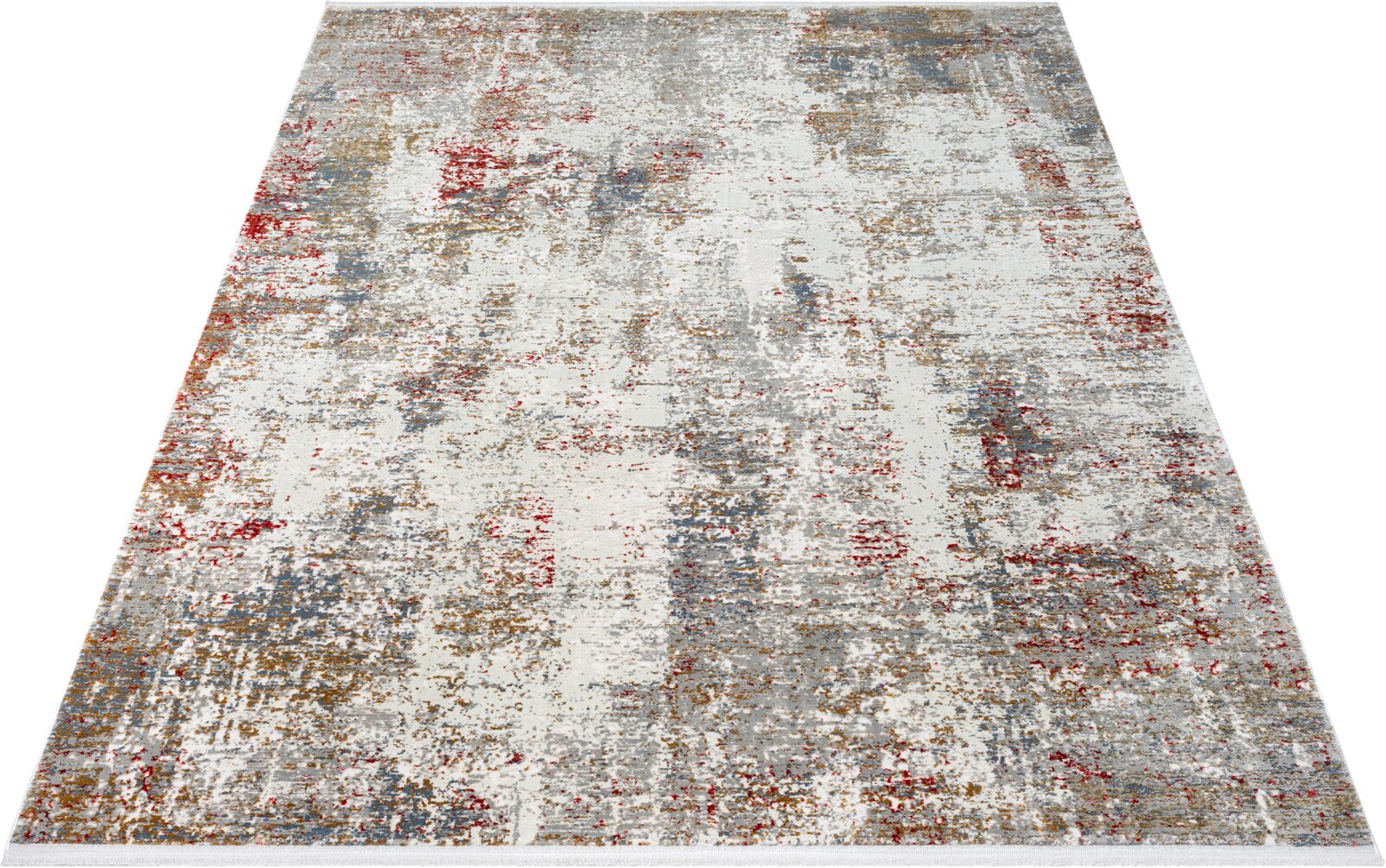 Moderner Teppich mit abstraktem Patchwork-Muster in Creme, Grau, Blau und Rot, in schräger Draufsicht freigestellt auf weißem Hintergrund