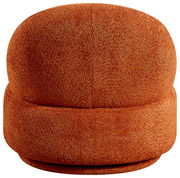 Roter, runder Sessel aus Stoff, frontal fotografiert.