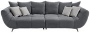 Graues Big-Sofa L mit mehreren Kissen, frontal betrachtet.