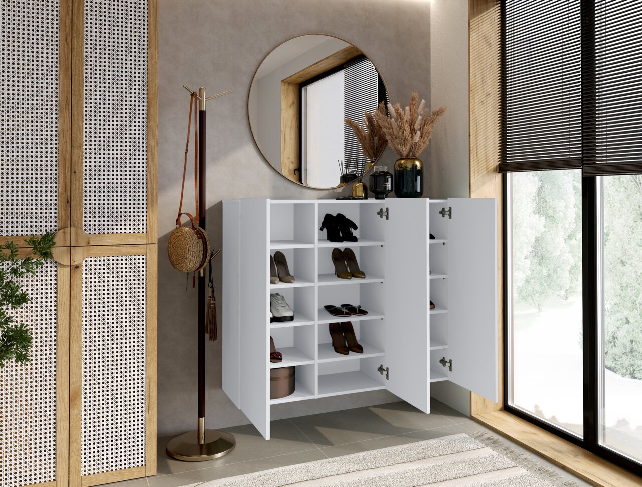 Moderne witte hangende schoenenkast met open deuren, gevuld met schoenen, in een stijlvol ingerichte kamer met een ronde spiegel en een raam op de achtergrond, gezien vanuit een zijdelingse hoek.