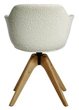 Rückansicht eines modernen Stuhls mit weißem, strukturiertem Stoffbezug und Holzbeinen.