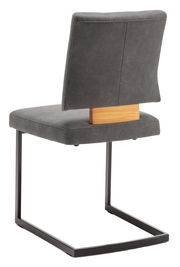 Rückansicht eines Freischwinger-Stuhls mit grauem Polster und schwarzem Metallgestell, Holzdetail an der Rückenlehne.