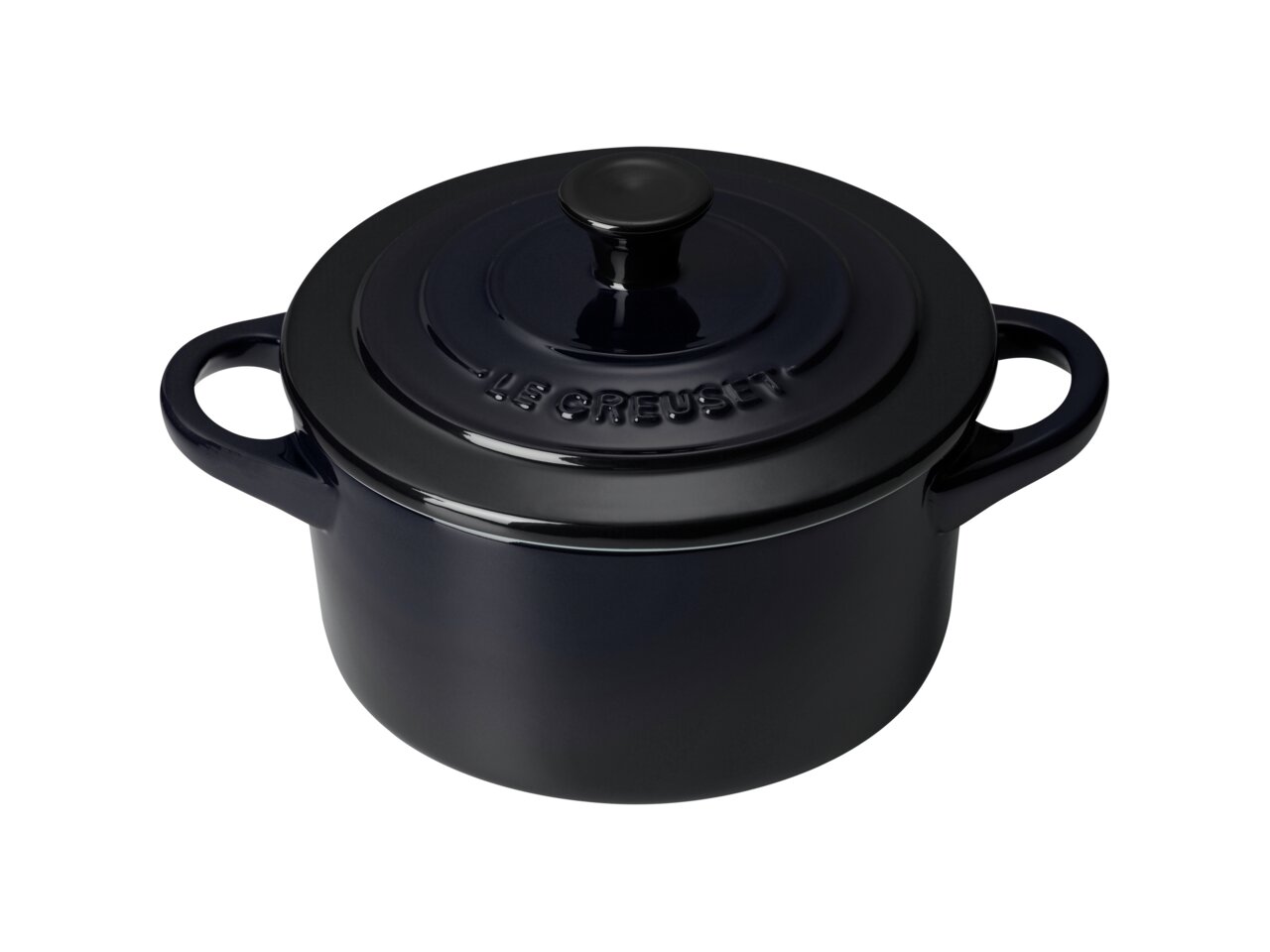 LE CREUSET Mini Cocotte 10 cm Schwarz Glänzend Schwarze Mini-Cocotte von oben mit zwei Griffen und Deckel, perspektivisch leicht von oben fotografiert.