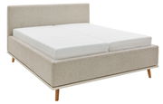 Beiges Polsterbett mit Holzfüßen, seitliche Perspektive