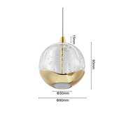 Elegante LED-Hängeleuchte von Dieter Knoll mit goldenen Akzenten und klarer Glaskugel, seitliche Perspektive.