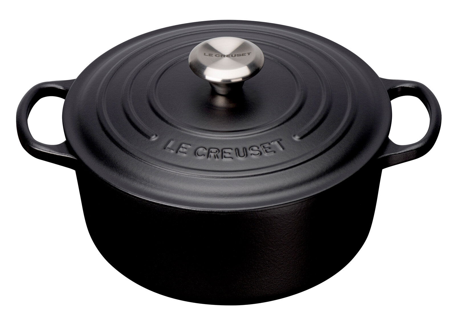 Schwarzer runder Bräter von Le Creuset mit Deckel und zwei Griffen, aus der Vogelperspektive.