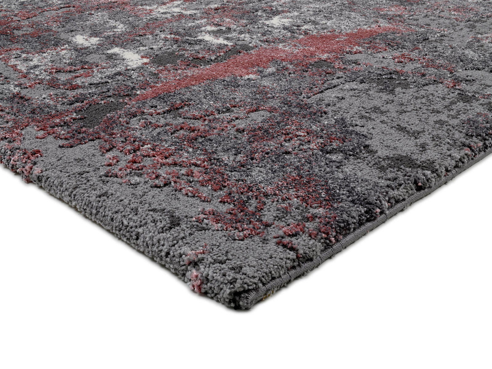 Nahaufnahme eines Designer Teppichs mit grauen und roten Mustern, seitliche Perspektive