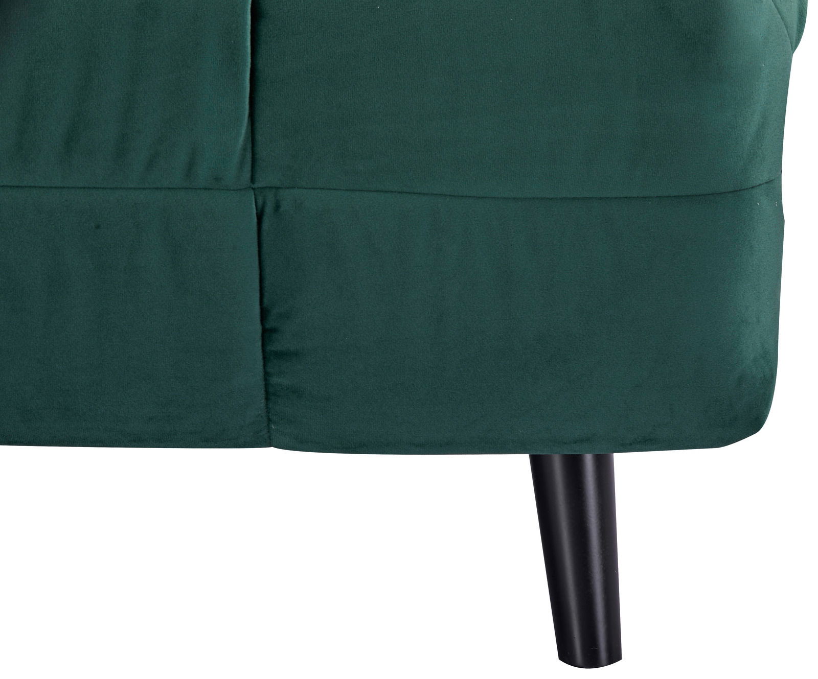 Nahaufnahme eines grünen Funktionssessels mit schwarzem Bein, seitliche Perspektive