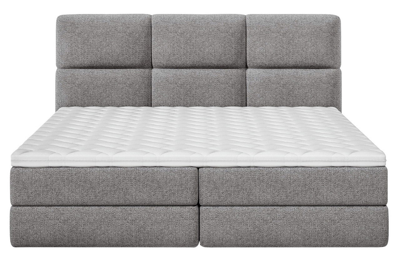 Frontale Ansicht eines grauen Boxspringbetts mit gepolstertem Kopfteil und weißer Matratze.