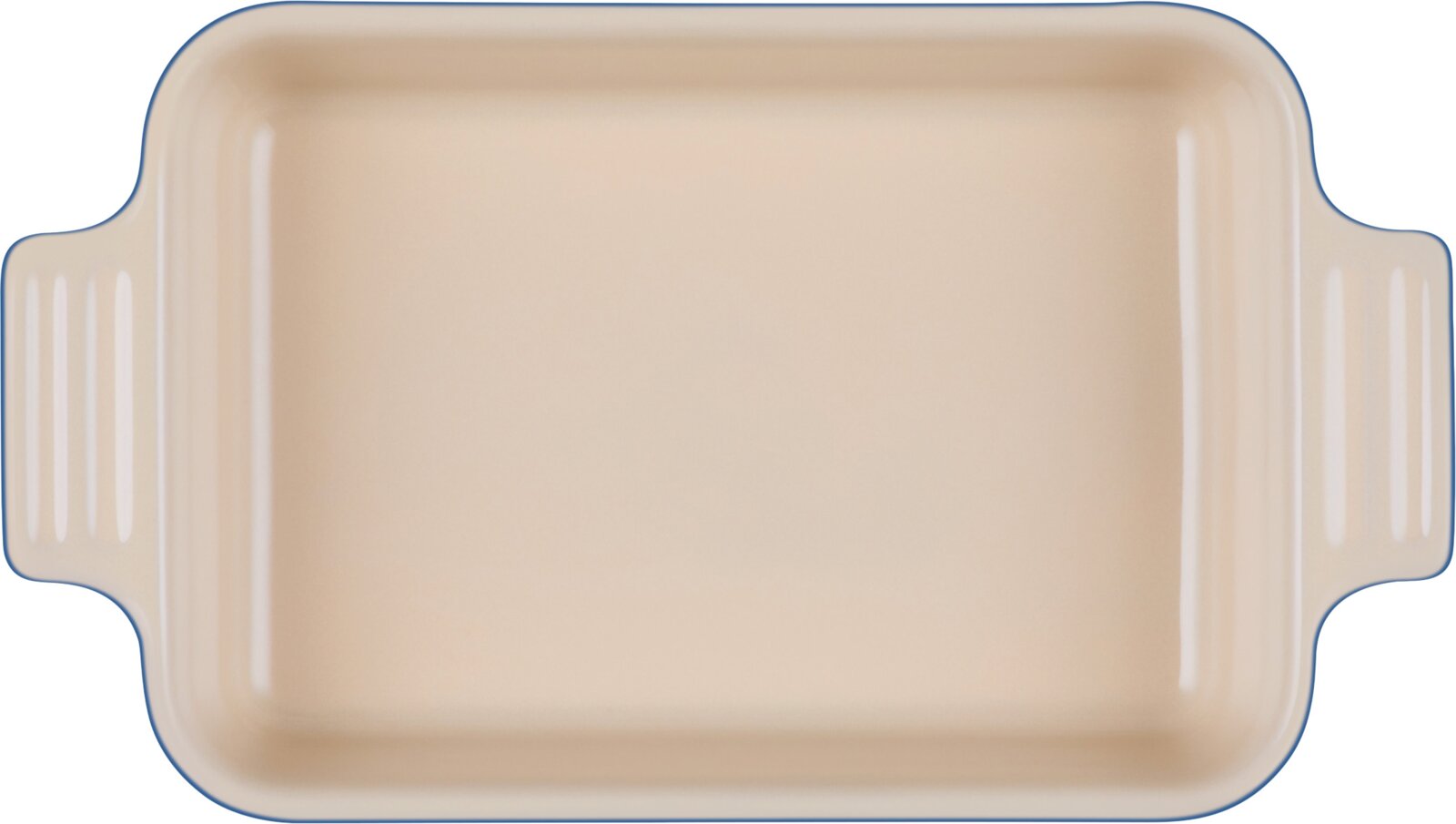 Rechthoekige beige ovenschaal met afgeronde hoeken en twee geribbelde handgrepen, van bovenaf gezien