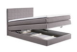 Graues Boxspringbett XORA HAWAII mit geöffnetem Bettkasten, seitliche Perspektive