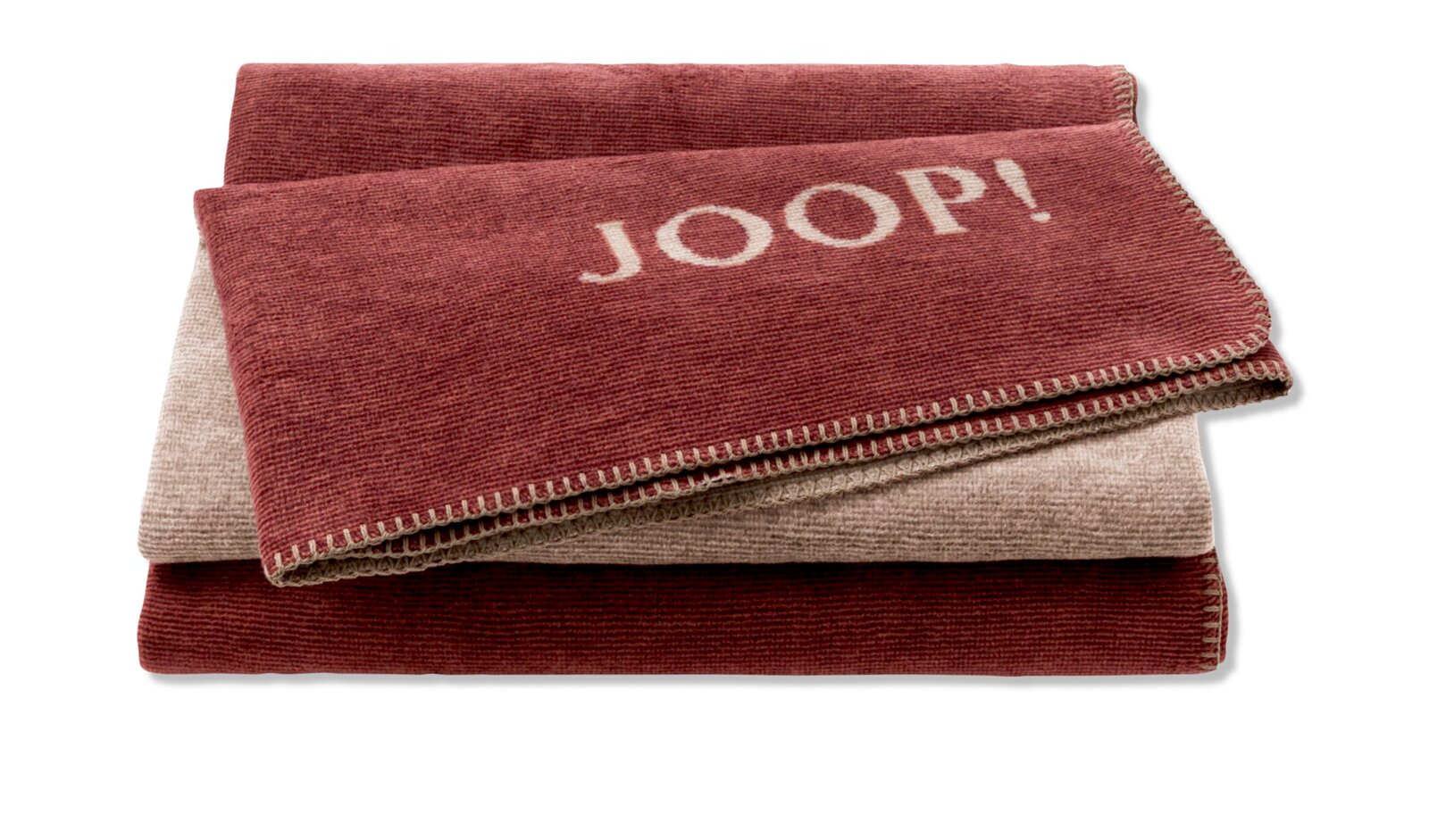 JOOP! Wohndecke MELANGE DOUBLEFACE Gestapelte JOOP! Decken in Melange-Optik, Vorderansicht, mit sichtbarem JOOP! Logo.