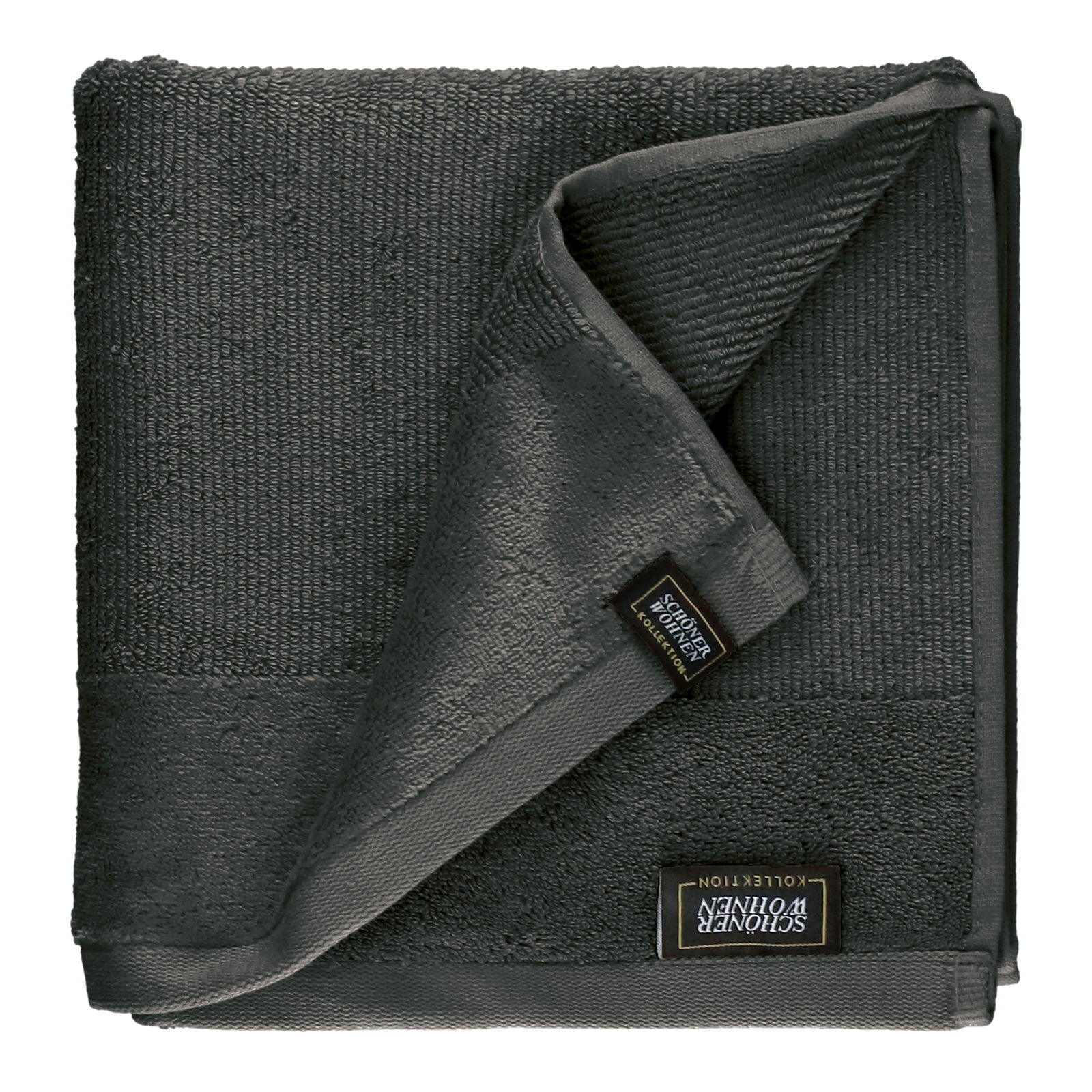 Dunkelgraues Frottierset, bestehend aus einem gefalteten Handtuch mit sichtbarem Etikett, aus der Vogelperspektive fotografiert.