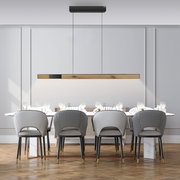 Moderne Pendelleuchte PURE-MOTO-RISE über einem Esstisch, seitliche Perspektive