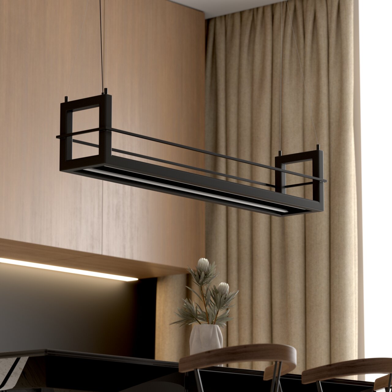 Zwarte, rechthoekige hanglamp in een modern metalen frameontwerp, opgehangen aan dunne kabels, in een schuin zijaanzicht van onderaf boven een tafel in een woonkamer.