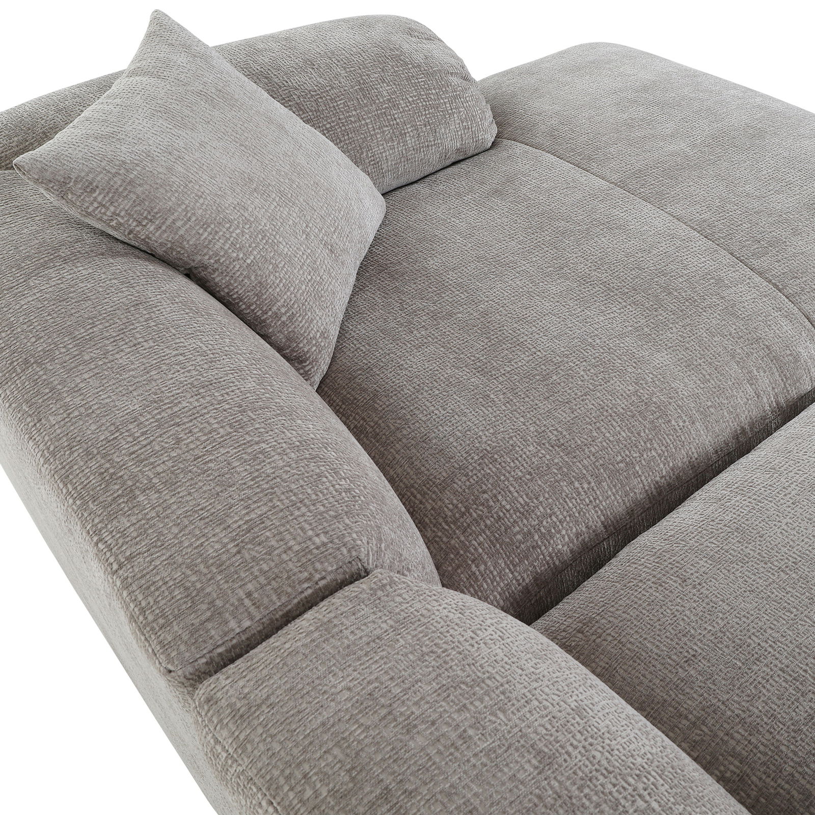 Graues Ecksofa CLASSY mit weicher Polsterung und Kissen, Perspektive von oben.