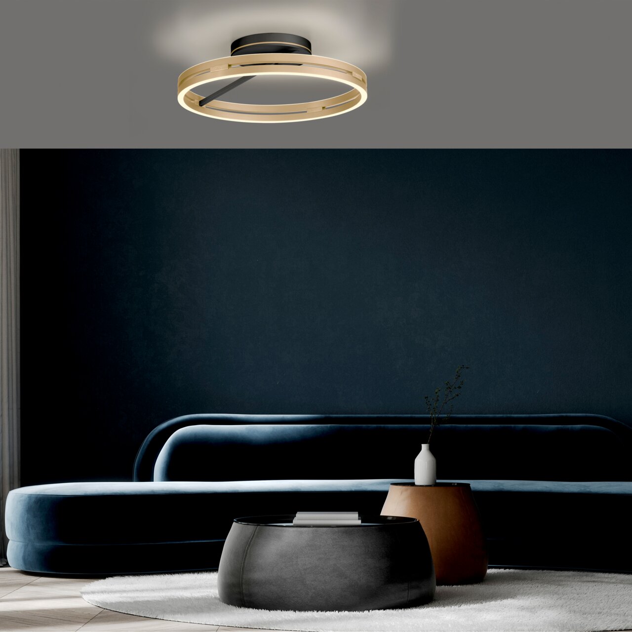 Moderne Deckenleuchte PURE Loop in einem stilvollen Wohnzimmer, von unten betrachtet.