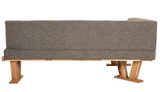 Rückansicht einer grauen Eckbank mit Holzfüßen