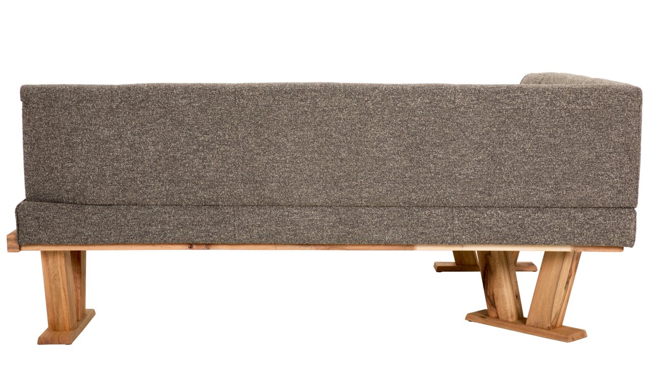 Rückansicht einer grauen Eckbank mit Holzfüßen