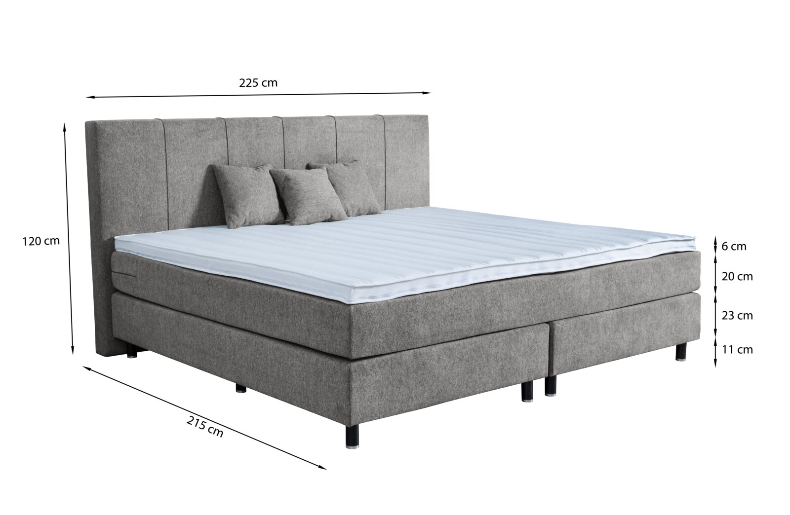 Graues Boxspringbett mit drei Kissen, seitliche Perspektive, Maße: 225 cm Breite, 215 cm Länge, 120 cm Höhe