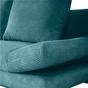 Nahaufnahme eines grünen Funktionssofas mit geripptem Stoffbezug, seitliche Perspektive