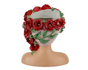 Blumentopf in Form eines Kopfes mit roten Blumen und grünen Blättern, Frontalansicht