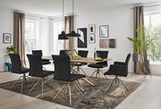 Esszimmer mit modernem Tisch und sechs schwarzen Stühlen, seitliche Perspektive