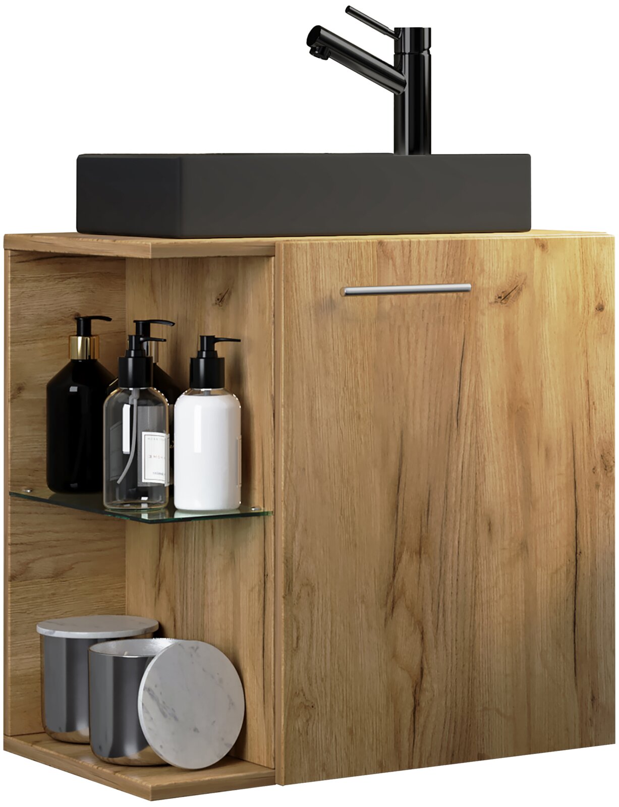 Badezimmer-Waschtischunterschrank aus hellem Holz mit schwarzem Aufsatzwaschbecken und schwarzer Armatur, rechts mit Tür und Griff, links offenes Fach mit Glasablage und Pflegeflaschen, Frontansicht leicht von links