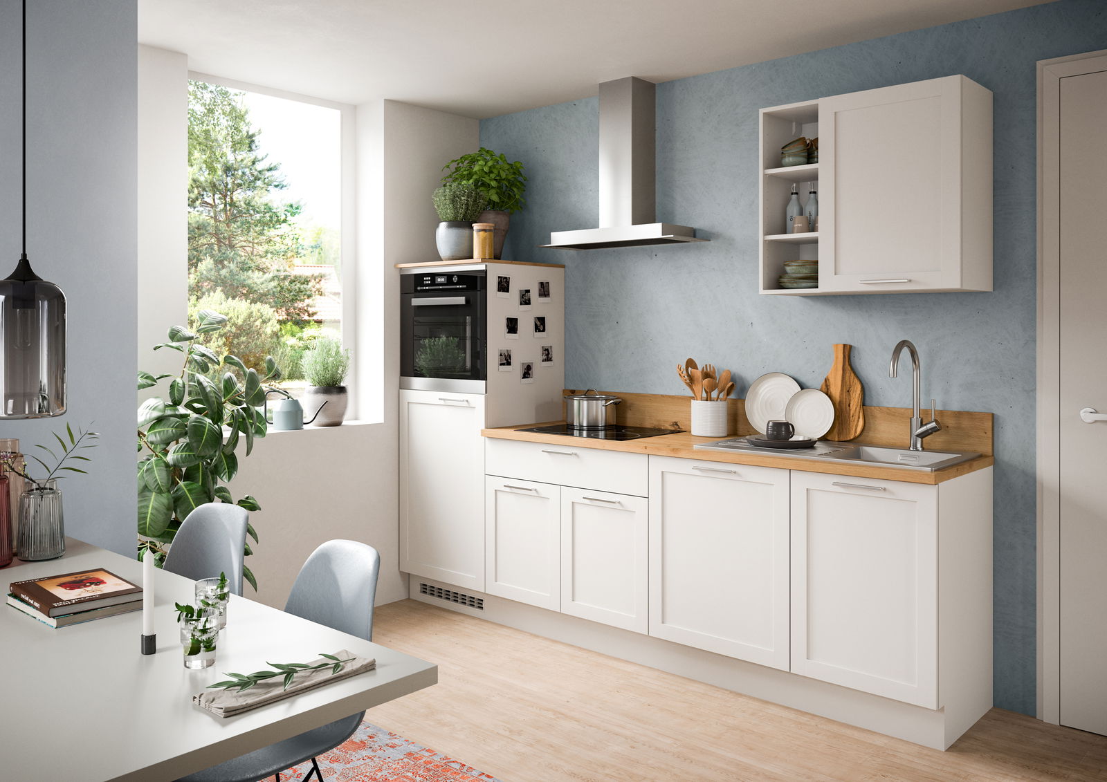 Moderne Küche mit weißem Küchenblock, Holzarbeitsplatte und eingebautem Ofen, seitliche Perspektive.