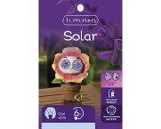 Solarbetriebene Figur in Form einer Blume mit beweglichen Augen, auf einem Tisch stehend, frontal betrachtet.