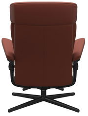 Rückansicht eines braunen Einzelsessels mit schwarzem Drehfuß