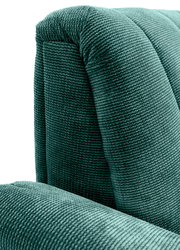 Nahaufnahme einer grünen, strukturierten Polsterung eines Sofas, perspektivisch von der Seite aufgenommen.