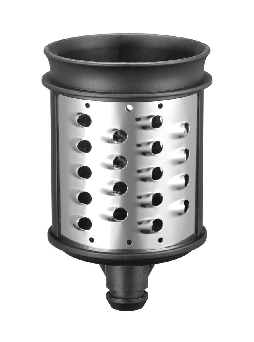 Nahaufnahme eines zylindrischen Gemüseschneider-Einsatzes aus Metall mit seitlichen Schlitzen, frontal betrachtet.