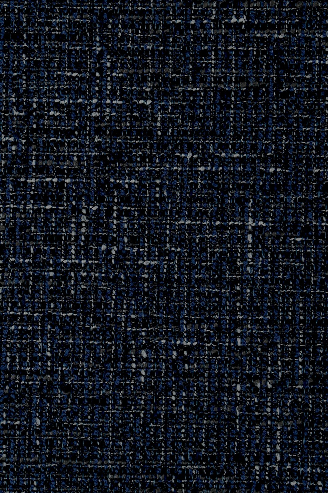 Close-up van een donkerblauw, gestructureerd stofpatroon, gezien van bovenaf