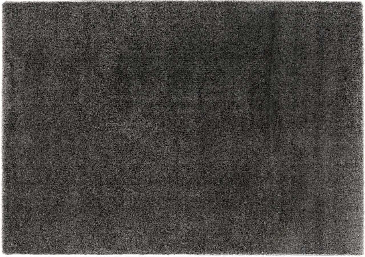 Draufsicht auf einen dunkelgrauen Hochflor-Teppich mit weicher Textur.