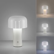 Moderne Akku-Tischleuchte AGNES mit weißem, zylindrischem Sockel und rundem, opalem Schirm, frontal abgebildet.