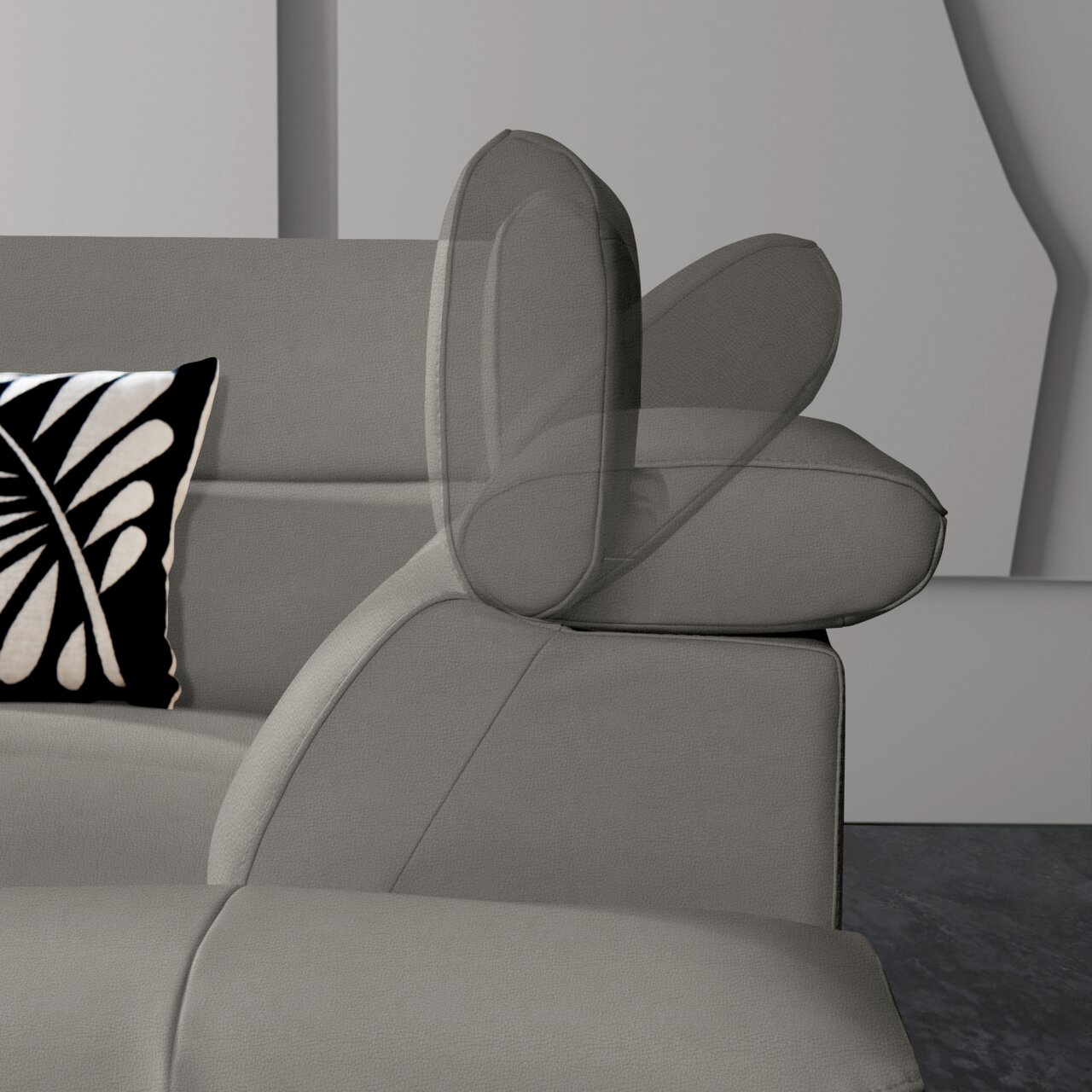 Graues Ecksofa mit verstellbarer Kopfstütze, seitliche Perspektive, dekoratives Kissen mit schwarz-weißem Muster.