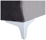 Nahaufnahme einer grauen Rundecke mit weißem Metallfuß, seitliche Perspektive