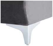 Nahaufnahme einer grauen Rundecke mit weißem Metallfuß, seitliche Perspektive