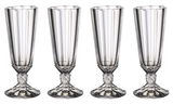 Vier elegante Sektkelche aus Kristallglas mit facettiertem Design, frontal abgebildet.