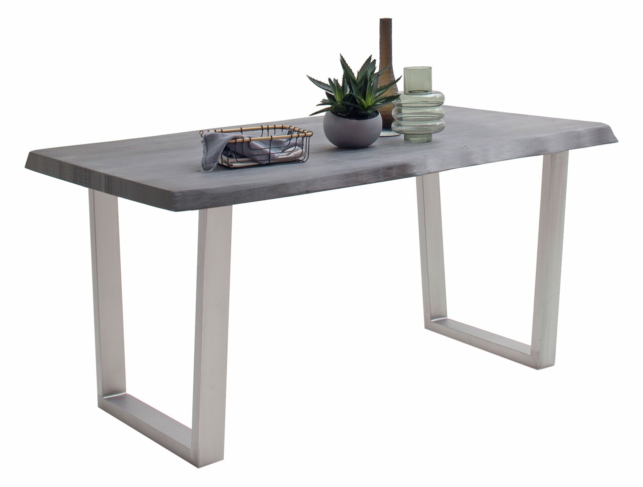 Moderne eettafel met grijs tafelblad en metalen poten, zijaanzicht