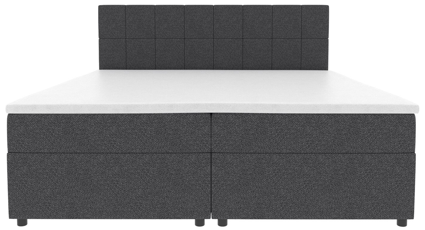 Dunkelgraues Boxspringbett mit gepolstertem, quadratisch gestepptem Kopfteil und weißer Matratzenauflage, Frontalansicht.
