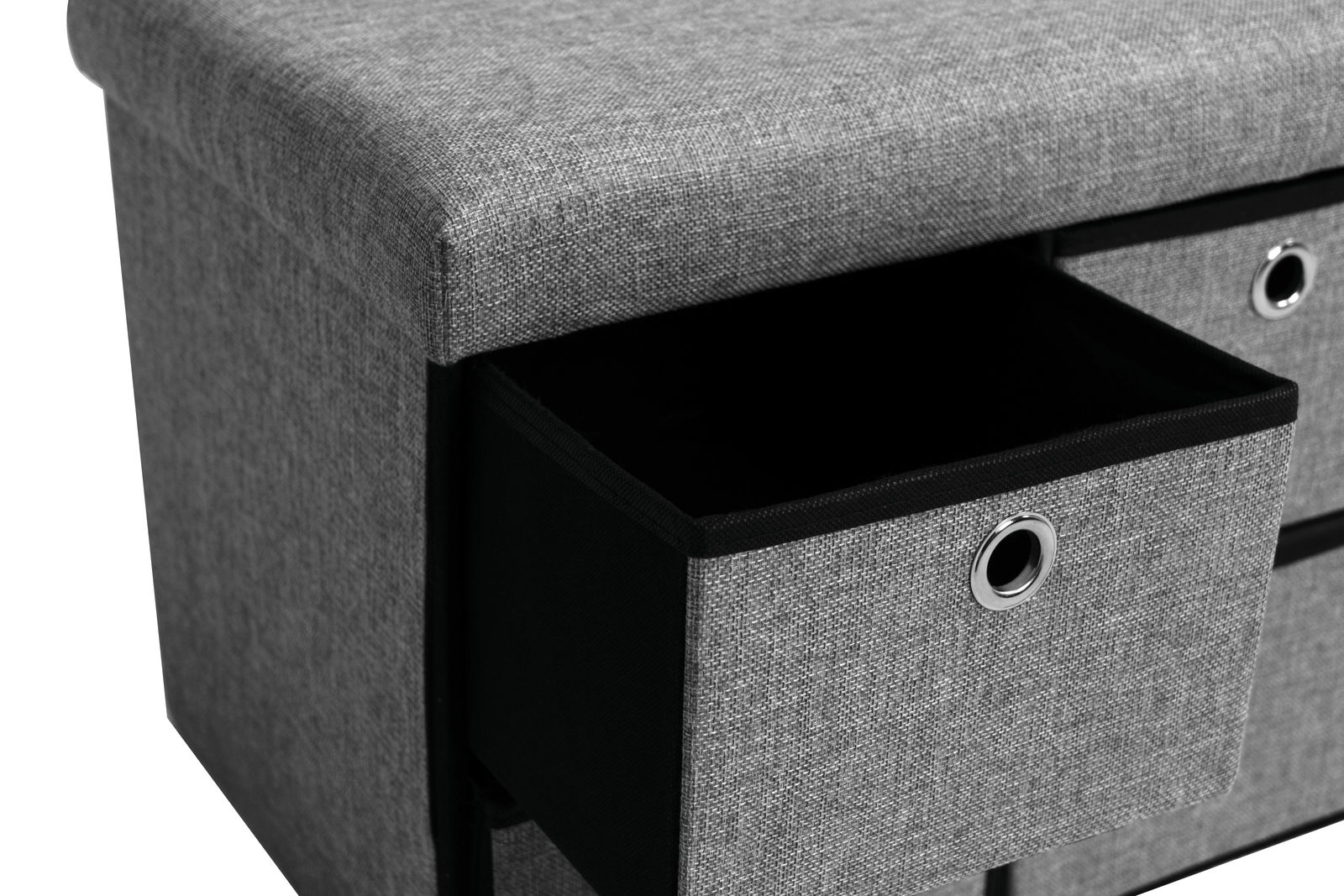 Graue Bank mit Stauraum, Nahaufnahme von der Seite mit herausgezogenem Schubfach.